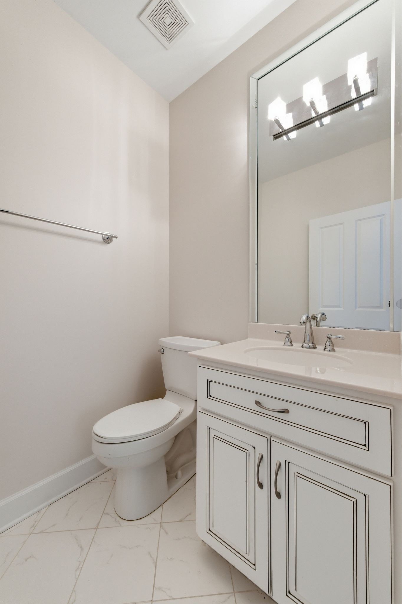 528 Country Club Drive Dickson, TN 37055 - Photo 29 of 55 a bathroom with a granite countertop toilet a sink and a mirror