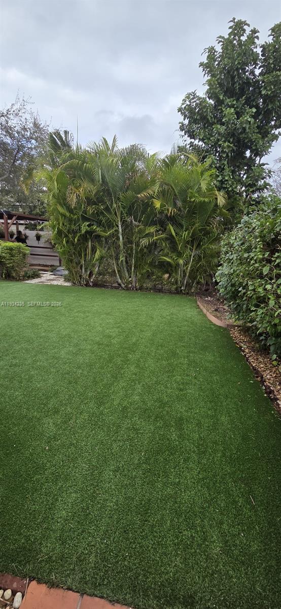 11787 Southwest 90th Terrace, Unit 11787 Miami, FL 33186 - Photo 12 of 17 a view of a field with an trees