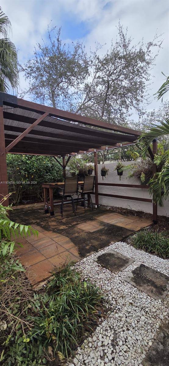 11787 Southwest 90th Terrace, Unit 11787 Miami, FL 33186 - Photo 14 of 17 a view of a backyard