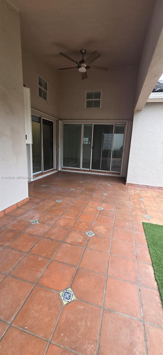 11787 Southwest 90th Terrace, Unit 11787 Miami, FL 33186 - Photo 16 of 17 a view of a brick house with many windows