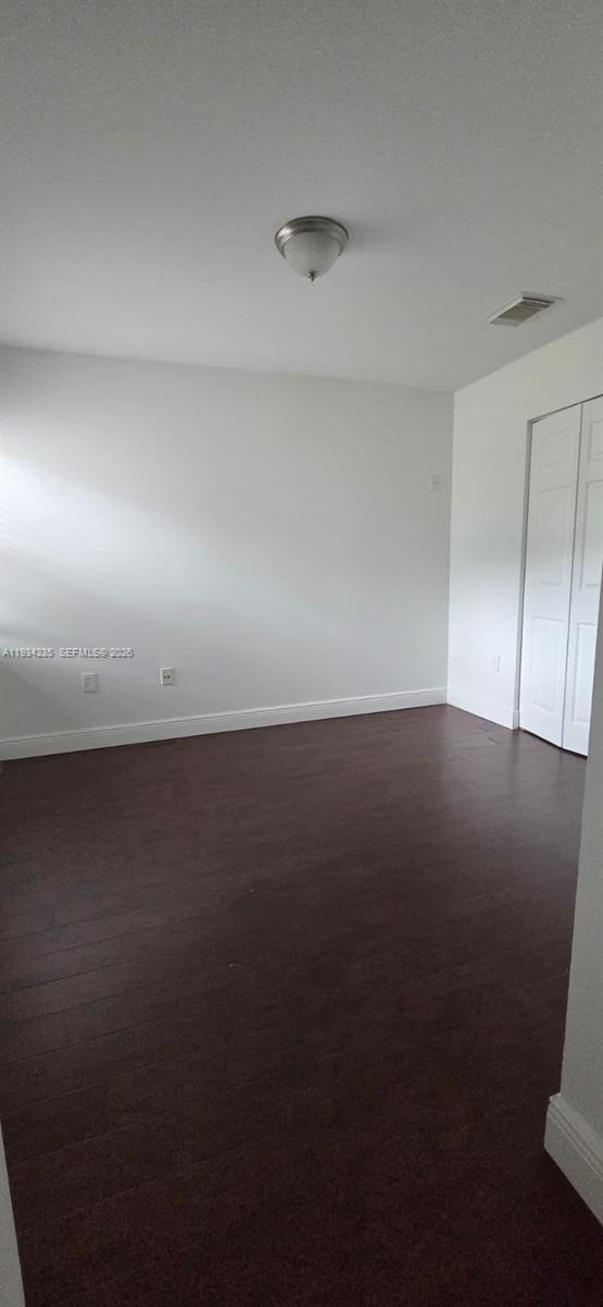 11787 Southwest 90th Terrace, Unit 11787 Miami, FL 33186 - Photo 8 of 17 an empty room with a window