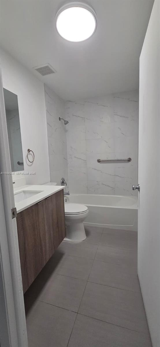 11787 Southwest 90th Terrace, Unit 11787 Miami, FL 33186 - Photo 9 of 17 a bathroom with a sink a toilet and a mirror