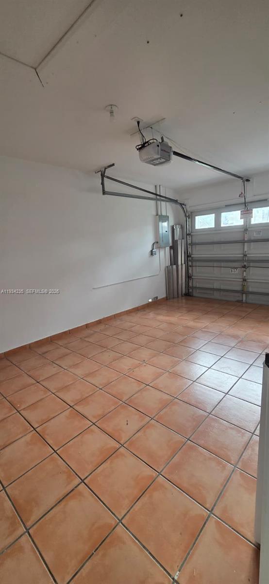 11787 Southwest 90th Terrace, Unit 11787 Miami, FL 33186 - Photo 10 of 17 a view of a room with racks on the wall