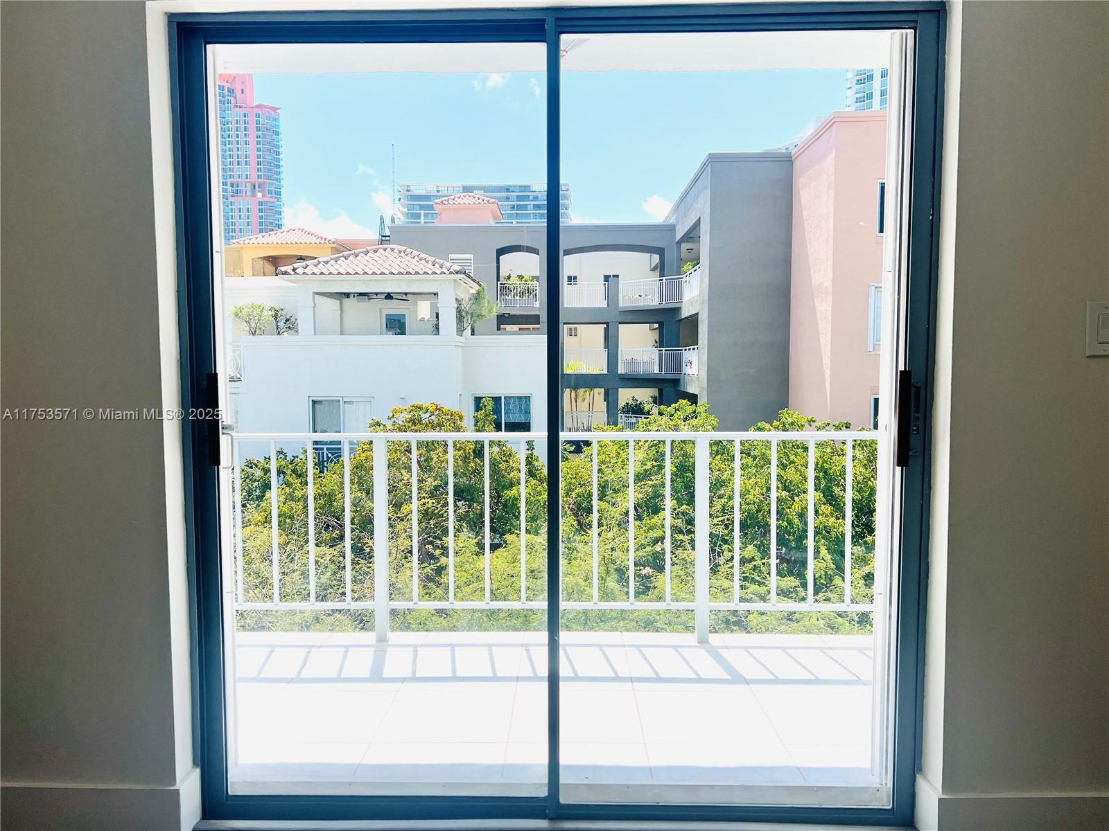 201 Jefferson Avenue, Unit 4C Miami Beach, FL 33139 - Photo 22 of 35 a view of a glass door and a window