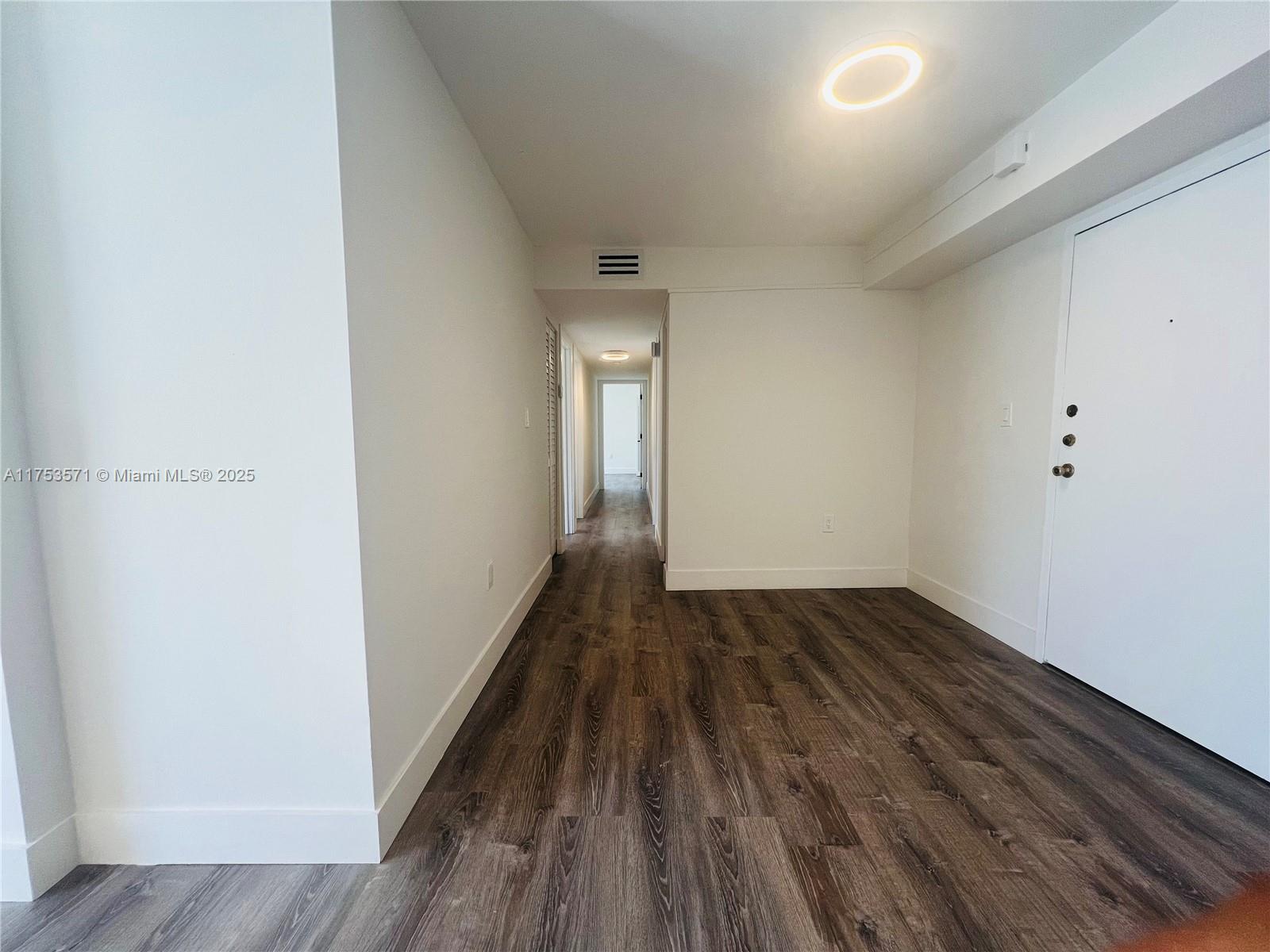 201 Jefferson Avenue, Unit 4C Miami Beach, FL 33139 - Photo 25 of 35 a view of a room with wooden floor and window