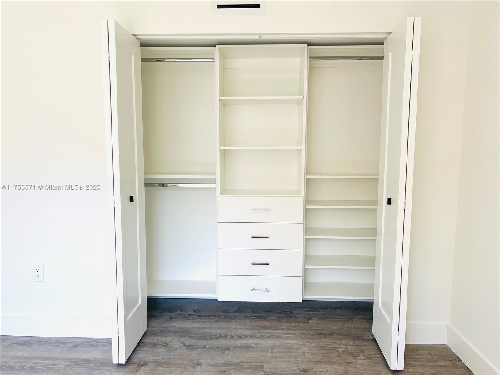 201 Jefferson Avenue, Unit 4C Miami Beach, FL 33139 - Photo 33 of 35 a view of walk in closet with empty racks