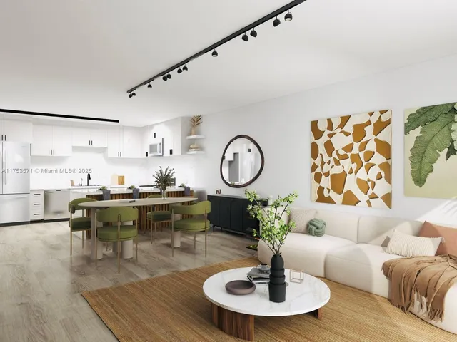 a living room with furniture a chandelier and a table