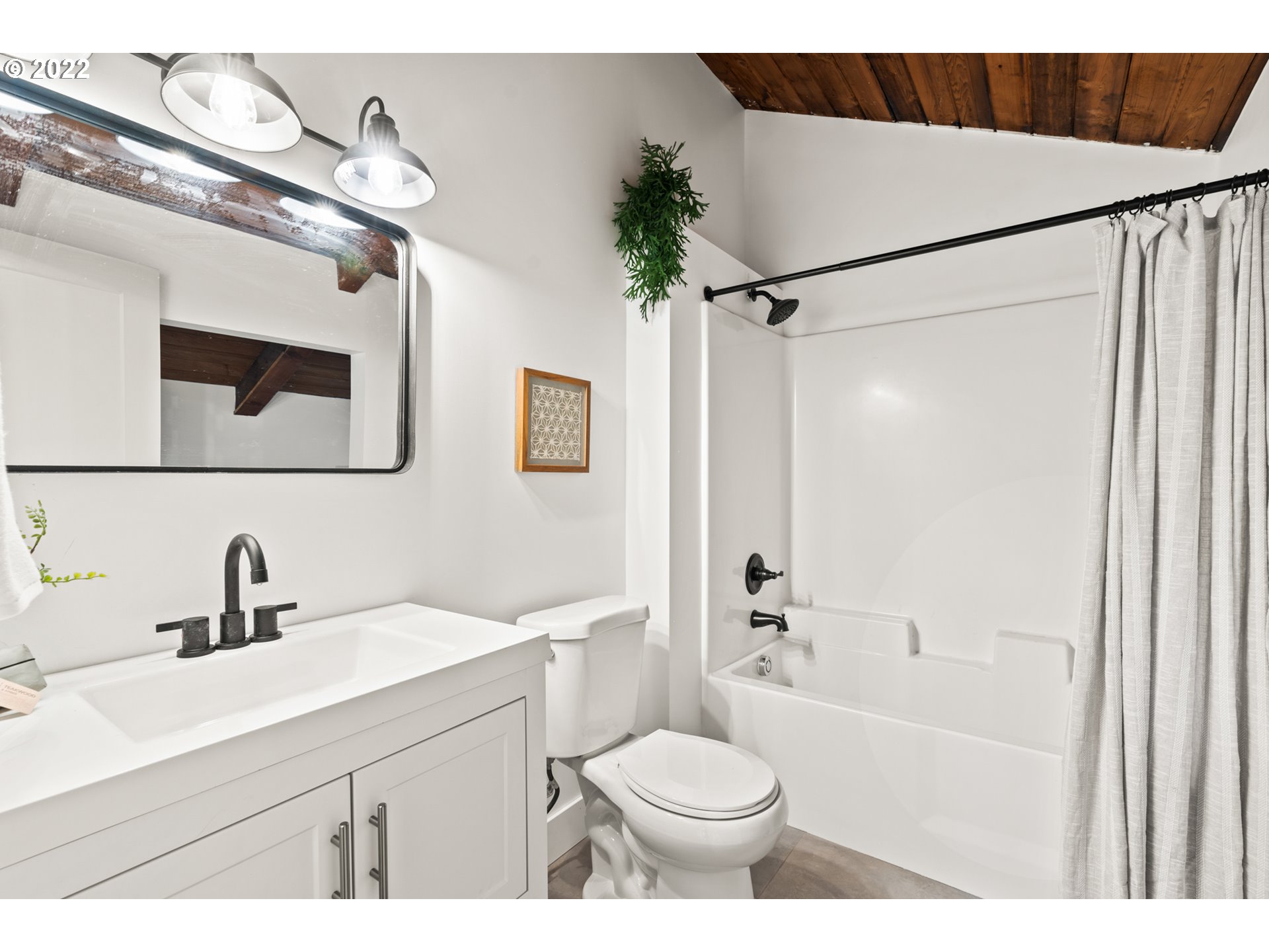 27678 South Uphill Road Colton, OR 97017 - Photo 18 of 29 a bathroom with a sink a toilet a mirror a vanity and shower