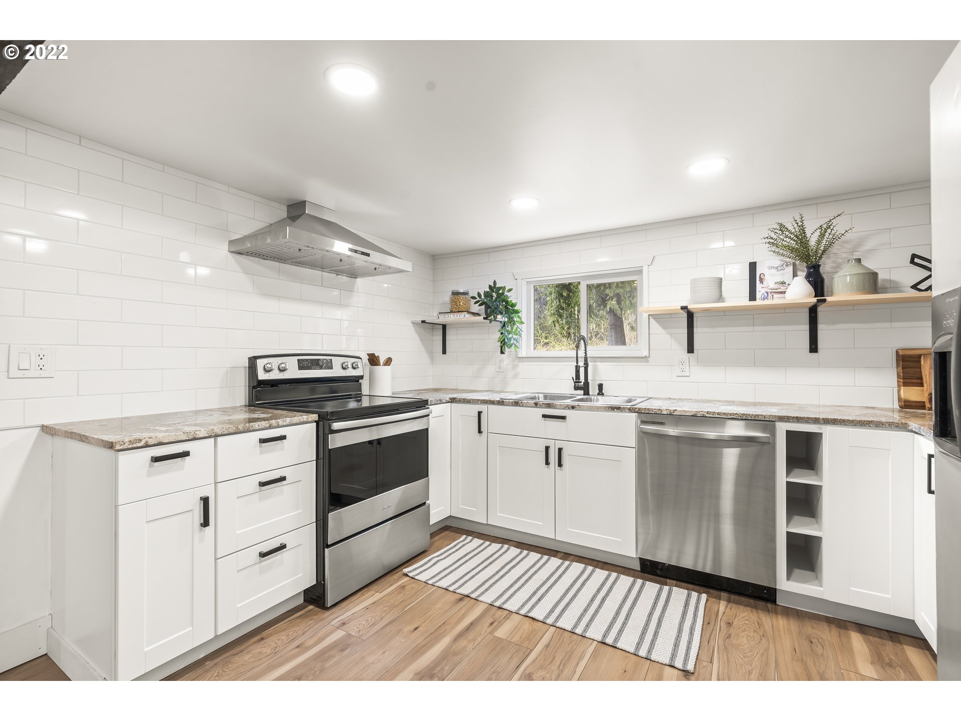 27678 South Uphill Road Colton, OR 97017 - Photo 6 of 29 a kitchen with stainless steel appliances granite countertop a stove a sink and a refrigerator