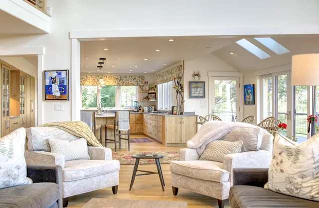 a dining room with furniture and wooden floor