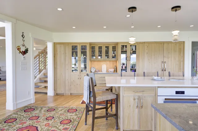 a living room with furniture a fireplace and a table