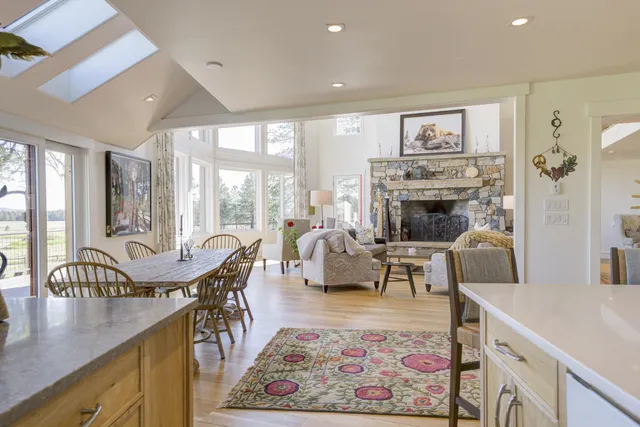 a bathroom with a granite countertop shower a sink and a mirror