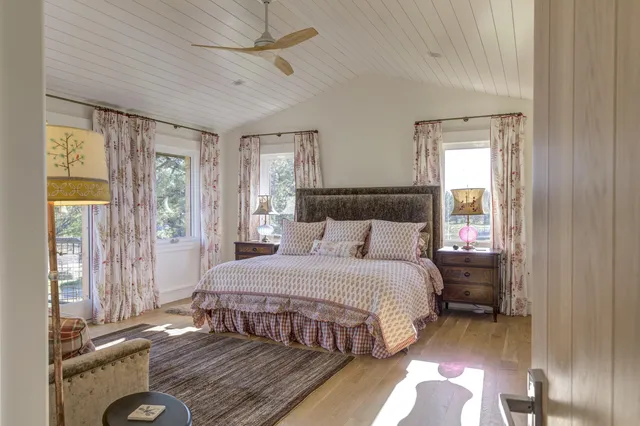 a room with lots of chairs and a rug