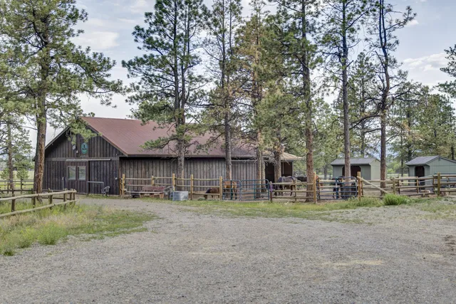a view of a house with a yard and a garden