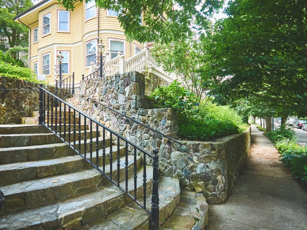 18 Atherton Road, Unit G Brookline, MA 02446 - Photo 2 of 15 a view of a building with a yard