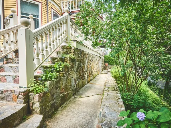 a view of a pathway of a house with wooden floor
