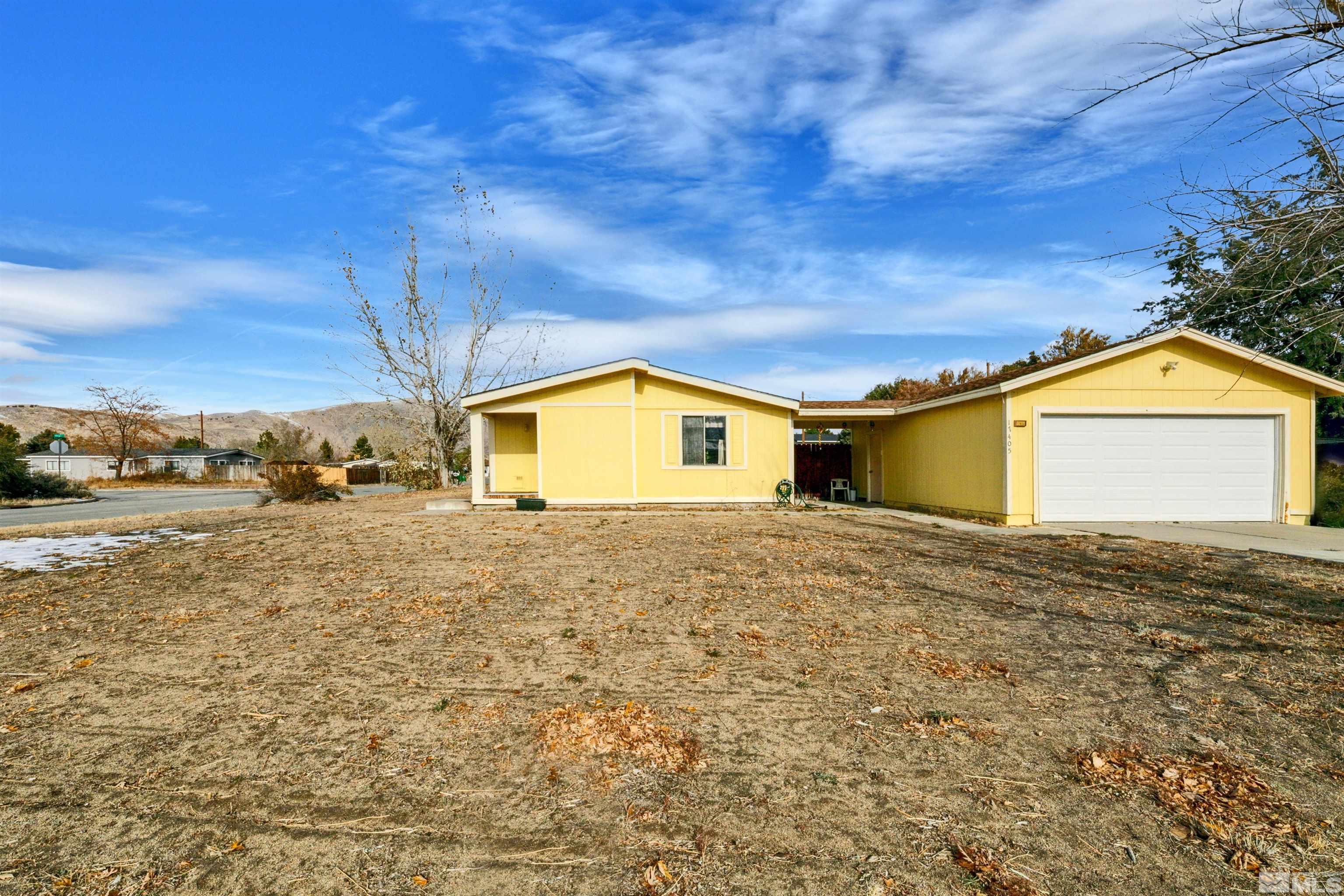 17405 Sunbird Lane Reno, NV 89508 - Photo 3 of 18 a view of a house with a yard