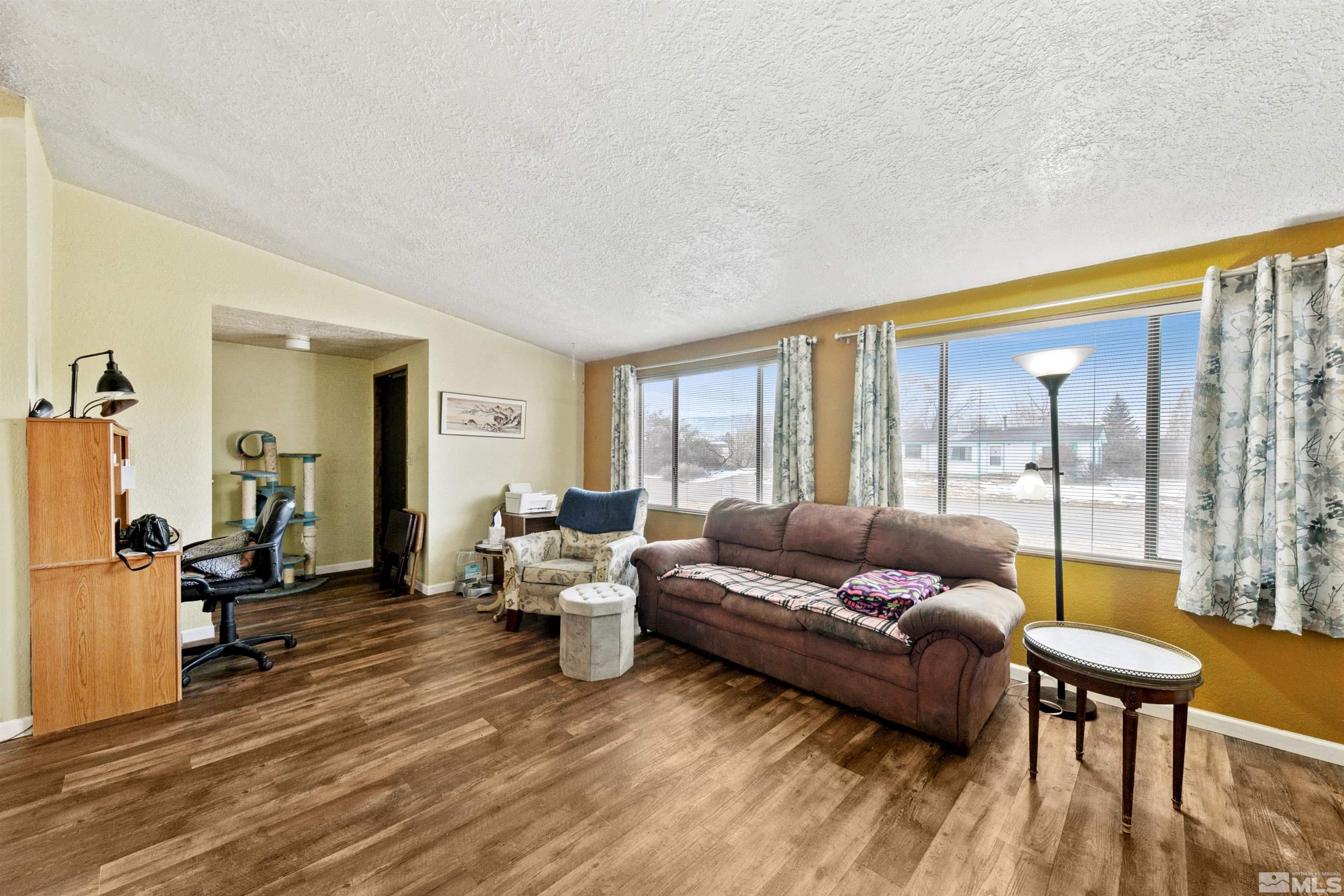 17405 Sunbird Lane Reno, NV 89508 - Photo 6 of 18 a living room with furniture and a large window