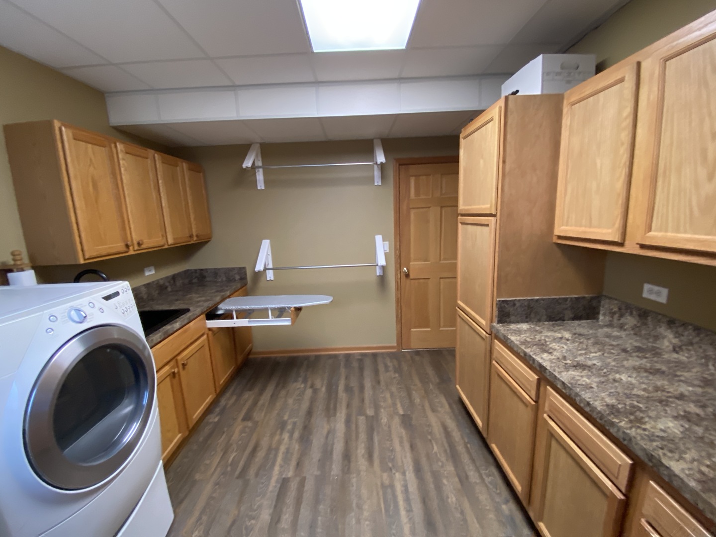 2N706 Howard Road Maple Park, IL 60151 - Photo 27 of 40 a view of a kitchen with a sink and wooden cabinets