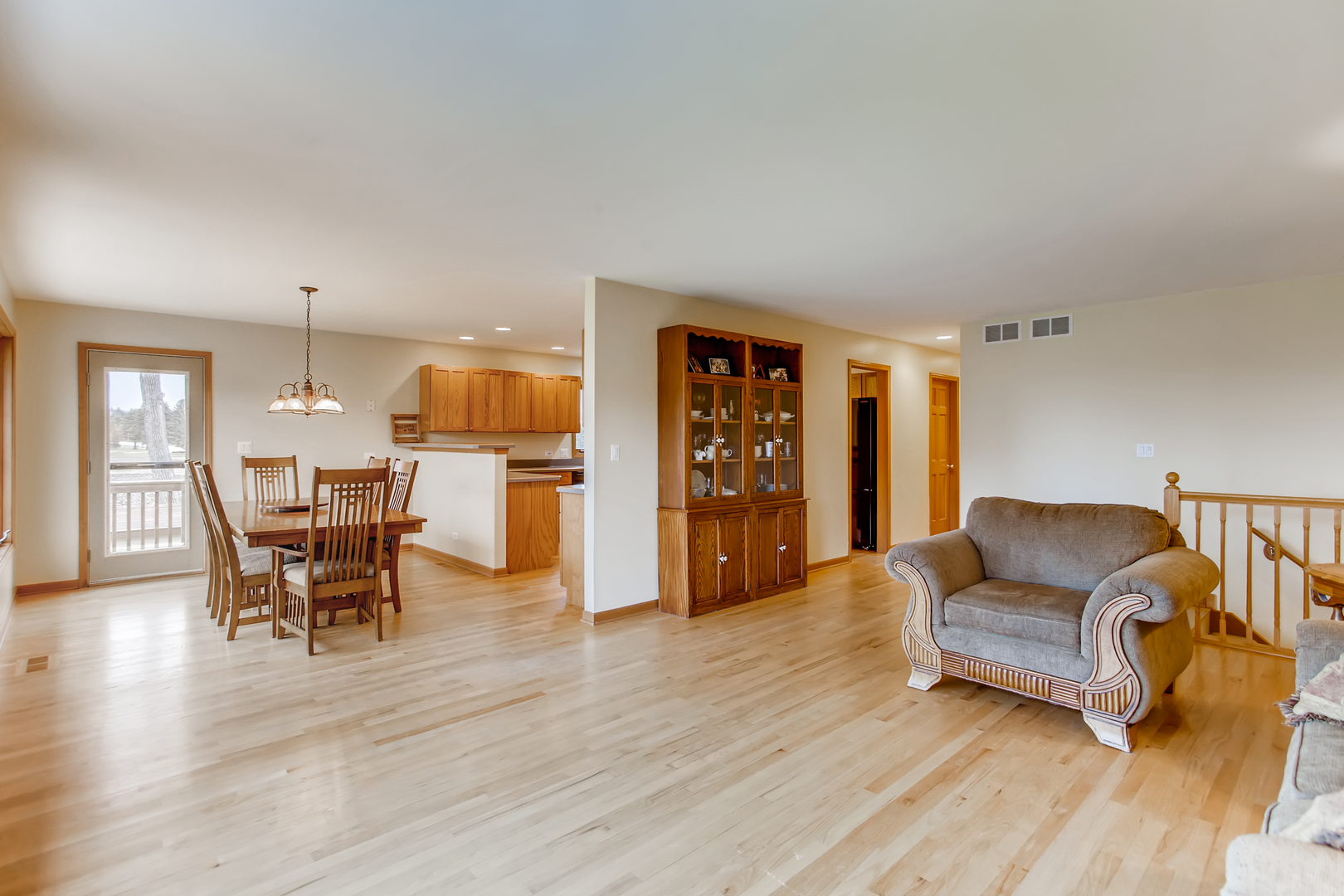 2N706 Howard Road Maple Park, IL 60151 - Photo 8 of 40 a living room with furniture and a wooden floor