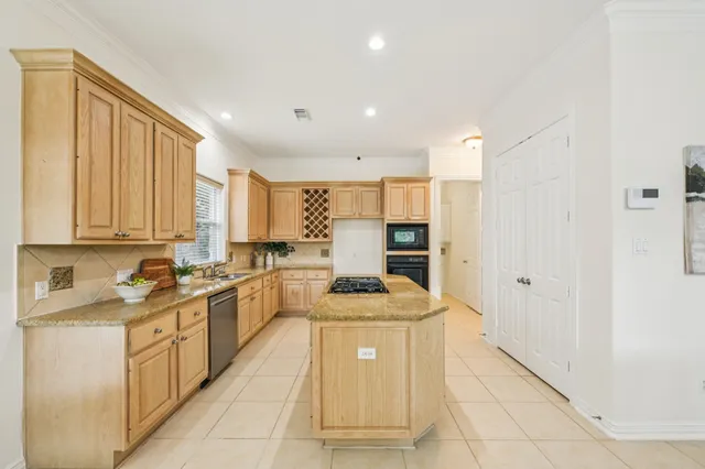 a kitchen with a sink a counter top space and appliances