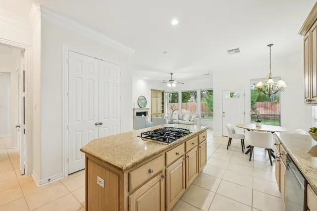a kitchen that has a stove and a table in it