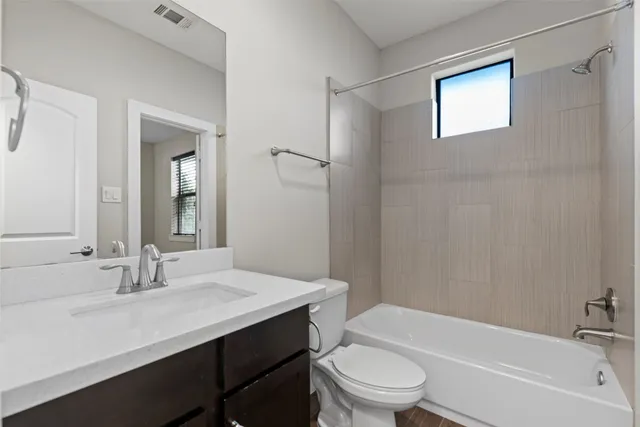 a bathroom with a sink a toilet and a bathtub