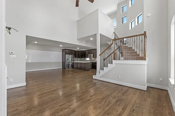 a view of entryway and hall with wooden floor