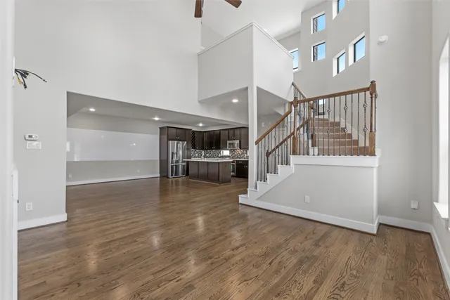 a view of entryway and hall with wooden floor