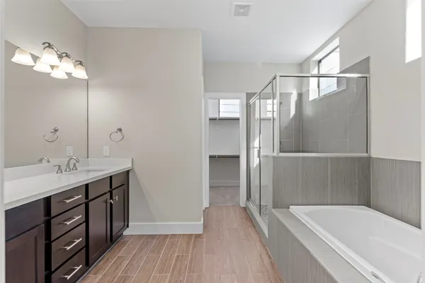 a bathroom with a bathtub and a shower