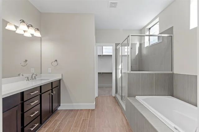 a bathroom with a bathtub and a shower