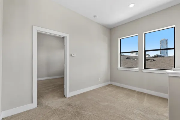a view of a room with wooden floor