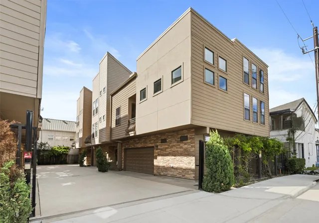 a view of a street with a building in the background