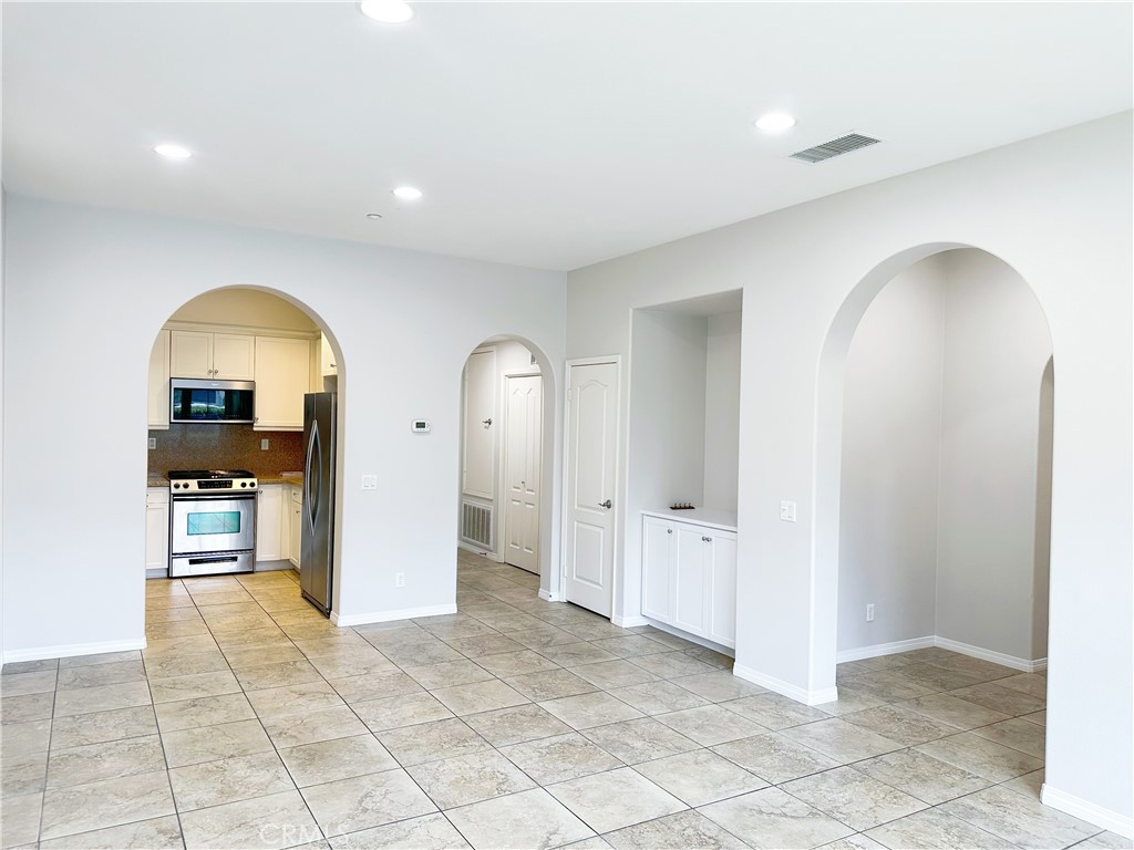 30 Pink Sage Irvine, CA 92620 - Photo 4 of 11 a view of a kitchen with furniture and staircase