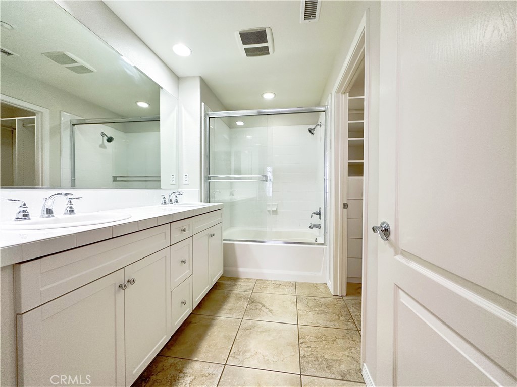 30 Pink Sage Irvine, CA 92620 - Photo 9 of 11 a spacious bathroom with a shower sink double mirror and a bathtub