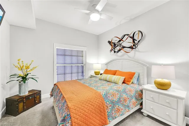 a bathroom with a sink a toilet a mirror a vanity a bathtub and shower