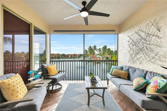a balcony with furniture and a rug