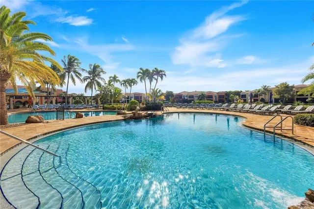 a view of swimming pool with outdoor seating