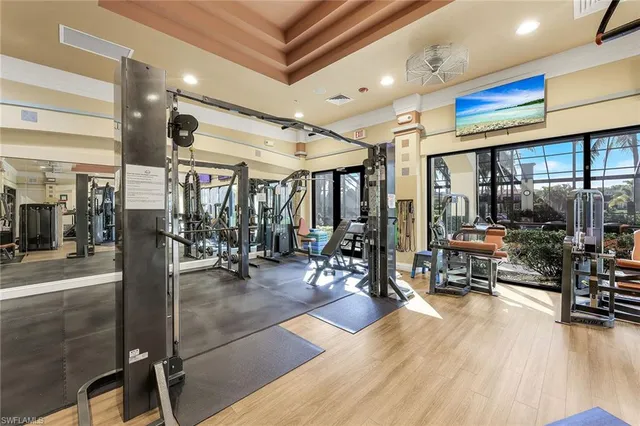 an aerial view of residential houses with outdoor space and lake view