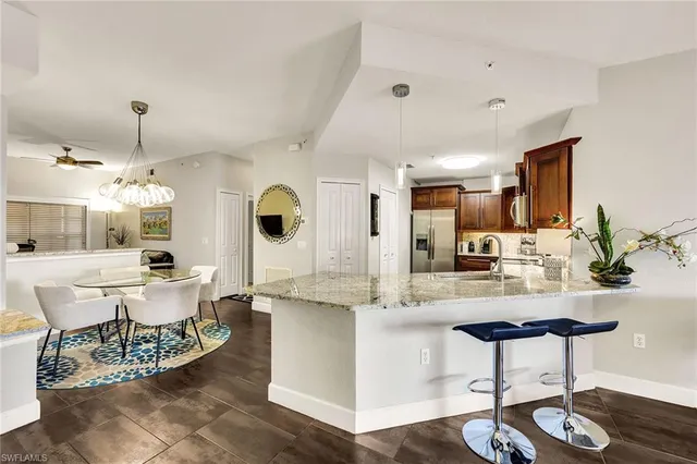 a kitchen with a sink stove and refrigerator