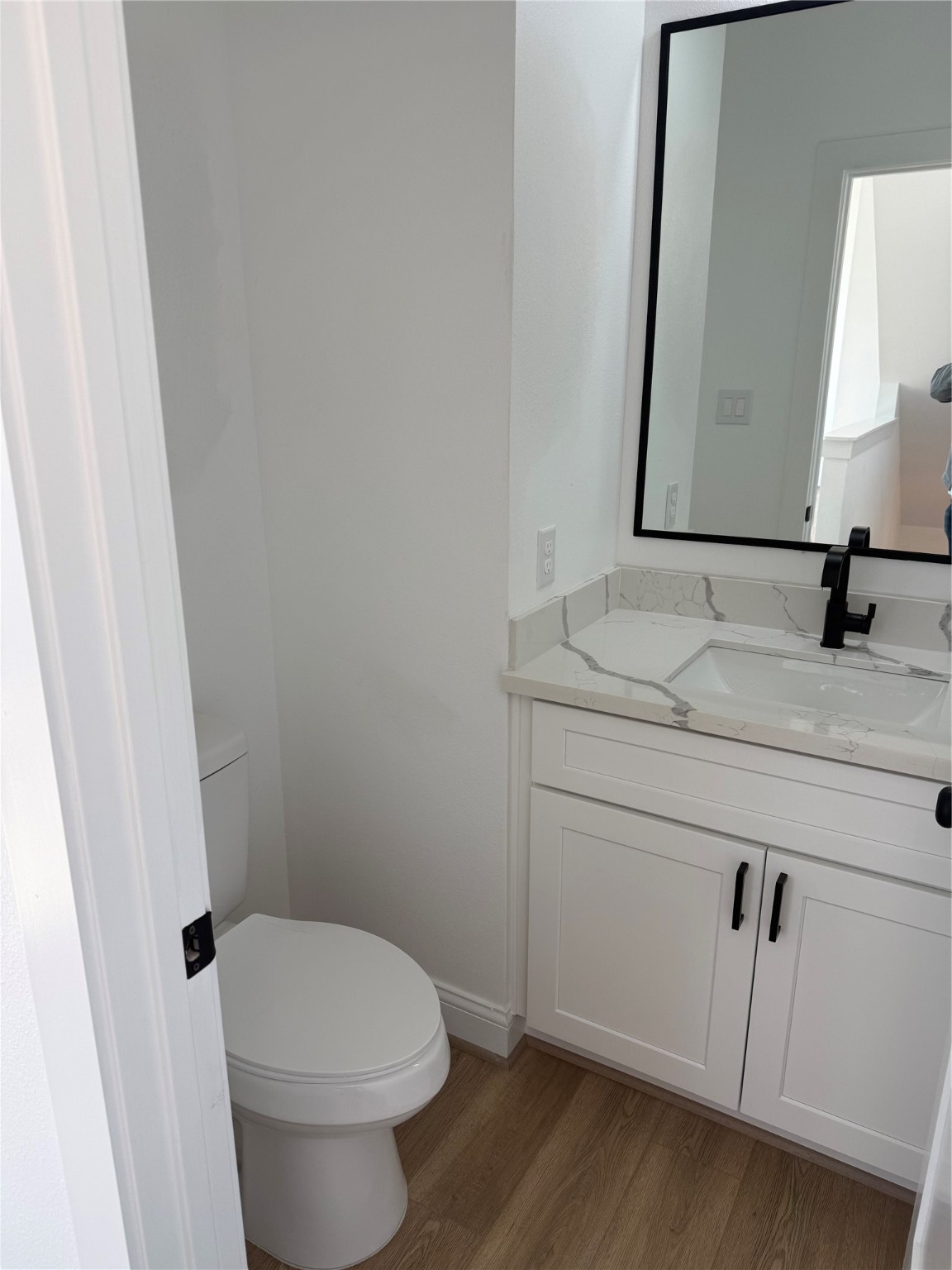 6350 Culberson Street Houston, TX 77021 - Photo 14 of 34 a bathroom with a granite countertop toilet sink and mirror