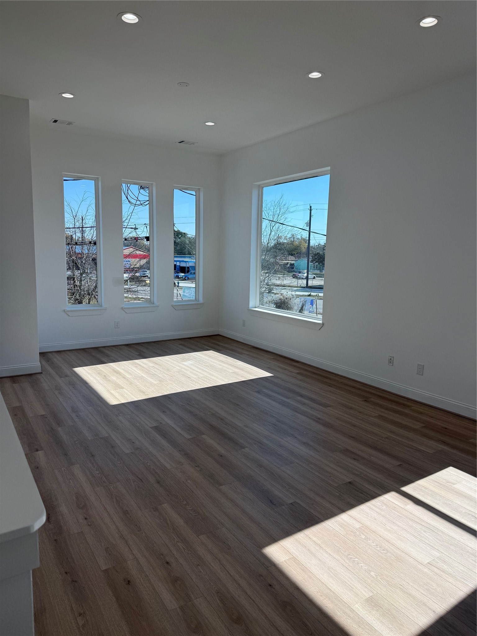 6350 Culberson Street Houston, TX 77021 - Photo 15 of 37 a view of an empty room with window and wooden floor