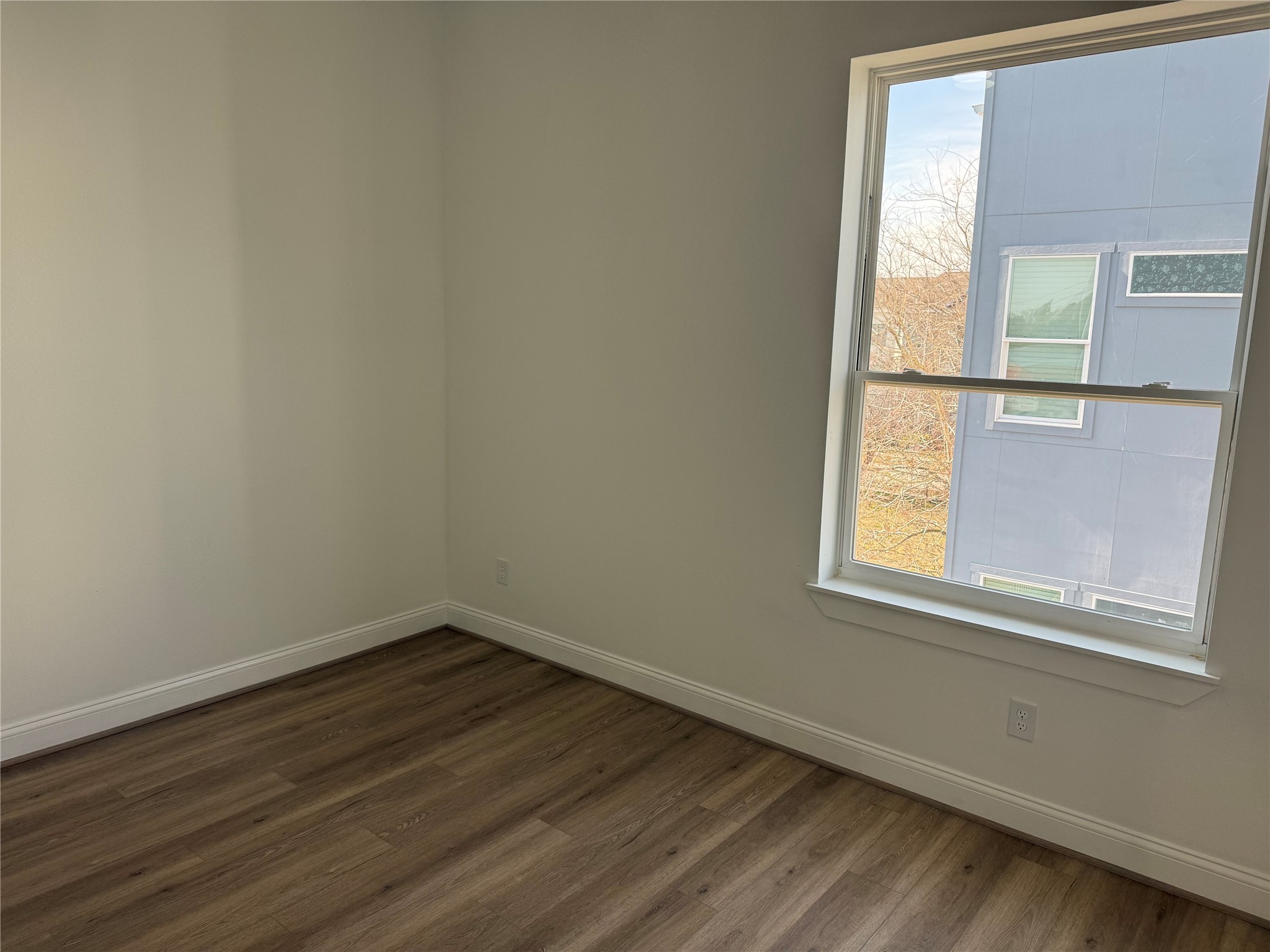 6350 Culberson Street Houston, TX 77021 - Photo 23 of 34 a view of an empty room with wooden floor and a window