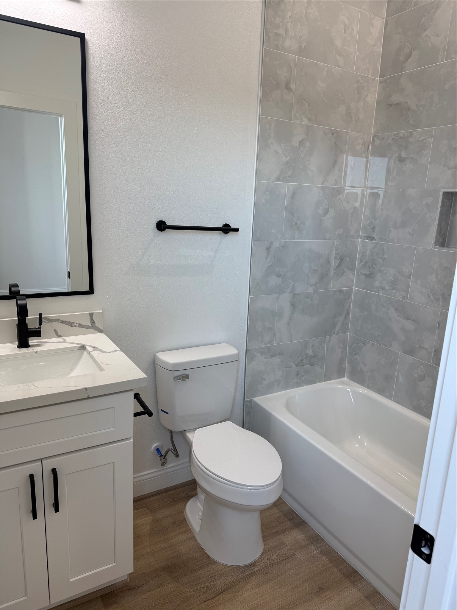 6350 Culberson Street Houston, TX 77021 - Photo 25 of 37 a white toilet sitting next to a bath tub