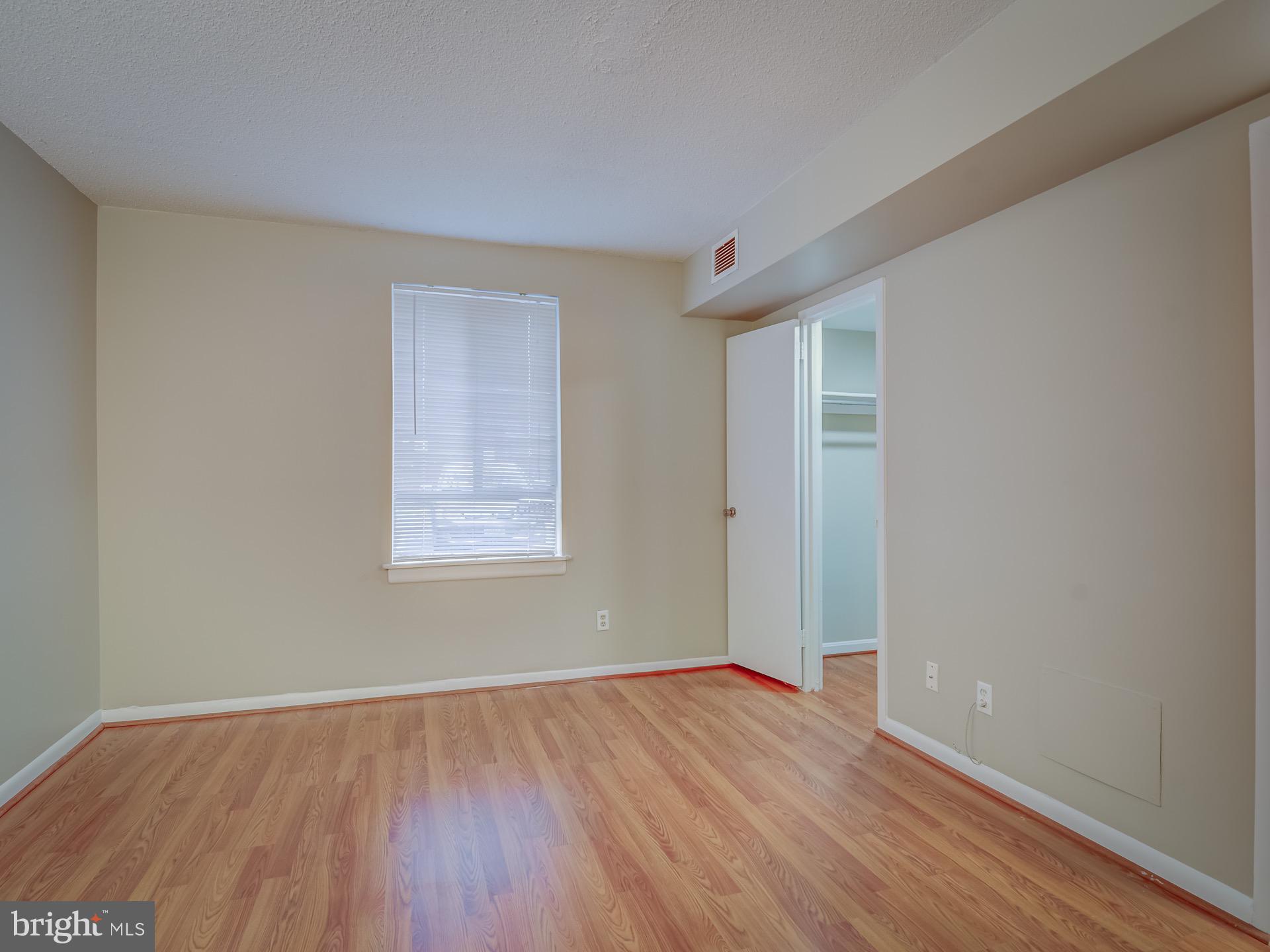 2243 Castle Rock Square, Unit 1B Reston, VA 20191 - Photo 14 of 20 Master Bedroom with Walk-In Closet