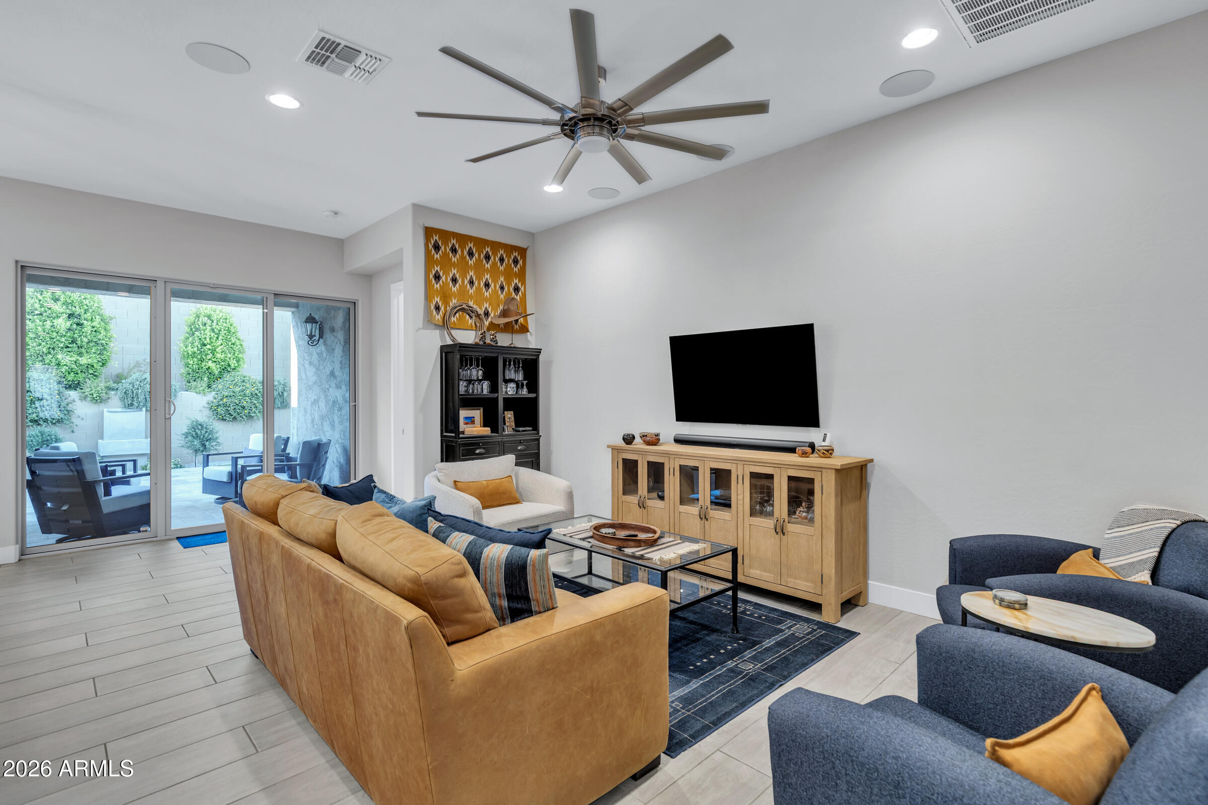 622 West Deer Creek Road Phoenix, AZ 85048 - Photo 15 of 39 a living room with furniture and a flat screen tv