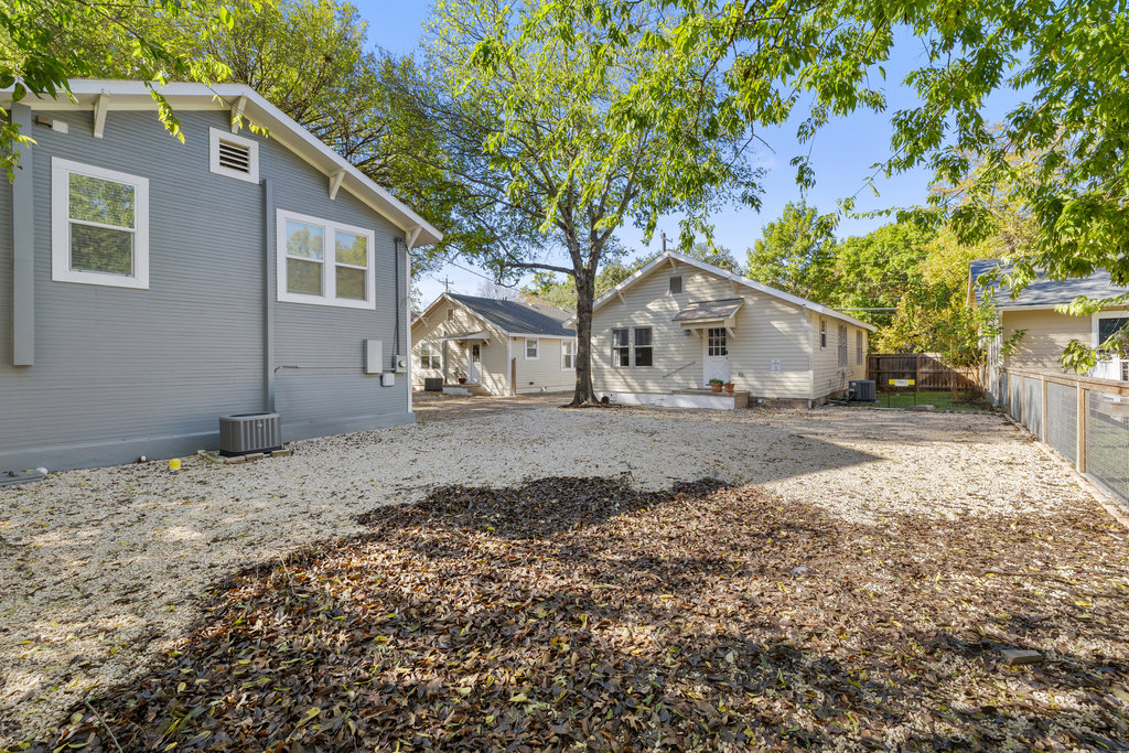 1223 1/2 South Austin Avenue Georgetown, TX 78626 - Photo 25 of 39 a view of white house with a yard