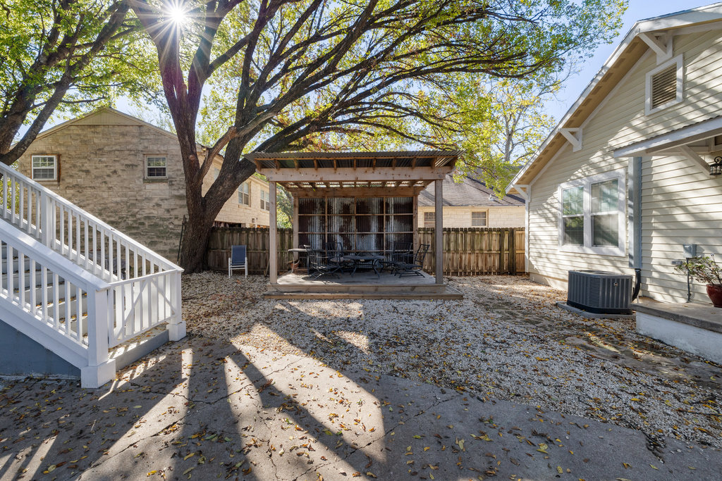 1223 1/2 South Austin Avenue Georgetown, TX 78626 - Photo 27 of 39 a view of a house with a yard and wooden fence