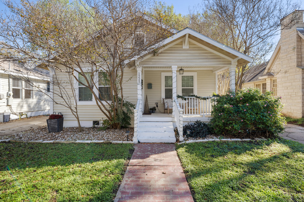 1223 1/2 South Austin Avenue Georgetown, TX 78626 - Photo 28 of 39 a front view of a house with a garden and plants