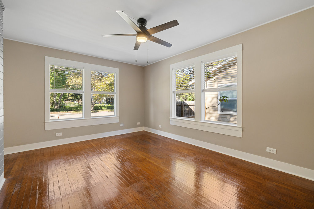 1223 1/2 South Austin Avenue Georgetown, TX 78626 - Photo 3 of 39 a view of an empty room with wooden floor and a window